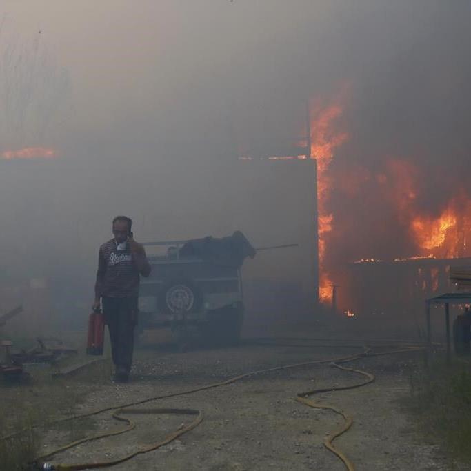 EU warns deadly flooding and wildfires show climate breakdown is fast becoming the norm